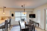 Dining Room with Flat Screen TV at Coastal Cottage